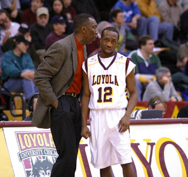 Loylola's Coach Farmer whispers instructions to Terrance Whiters (2004). Photo by Brian M. Payne.